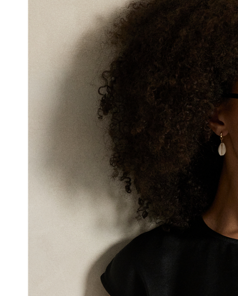 This satin dress features a clean-lined construction with a rounded neckline, cap sleeves and a centre back keyhole that secures with a genuine mother-of-pearl button.