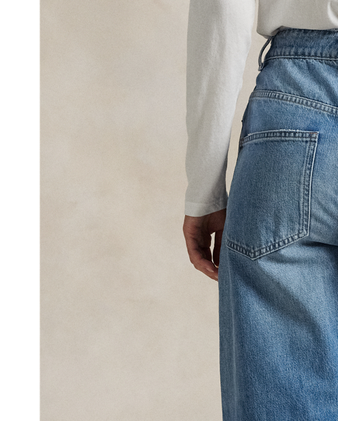 Washed for a medium indigo hue, this version of our Relaxed Tapered jean is crafted from non-stretch cotton denim and features subtle distressed details for a lived-in look.