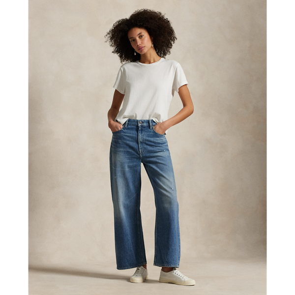 Designed for a cropped, wide-leg silhouette, these high-rise jeans are crafted from medium-weight Turkish denim with authentic slub character. The medium indigo wash has a vintage-inspired look thanks to uneven hand-sanding, whiskering and grinding on the seams.