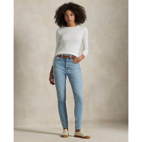 Crafted with Turkish denim, this High-Rise Super-Slim jean is dyed for a versatile light wash and treated with a combination of whiskering and subtle hand-sanding for a lived-in finish.