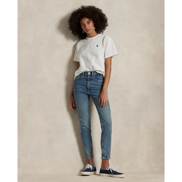 Crafted with Turkish right-hand twill, this High-Rise Super-Slim jean is dyed for a versatile medium wash and treated with a combination of whiskering and subtle hand-sanding for a lightly worn finish.