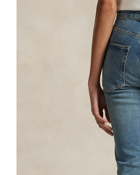 Crafted with Turkish right-hand twill, this High-Rise Super-Slim jean is dyed for a versatile medium wash and treated with a combination of whiskering and subtle hand-sanding for a lightly worn finish.