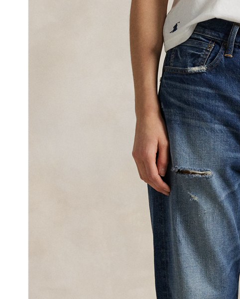 Cut with medium-weight cotton denim, this Slouch Tapered jean is designed for a perfectly worn, vintage-inspired look. The indigo wash is combined with uneven hand-sanding and grinding throughout.