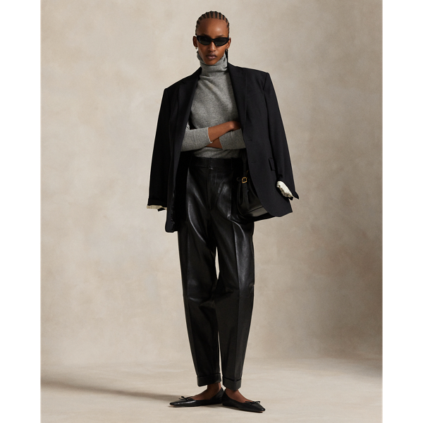 These luxe trousers combine classic menswear-inspired details, such as tailored pleating, creases at the leg and folded cuffs, with a tapered silhouette rendered in supple lambskin.