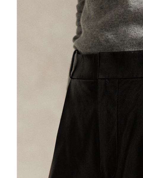 These luxe trousers combine classic menswear-inspired details, such as tailored pleating, creases at the leg and folded cuffs, with a tapered silhouette rendered in supple lambskin.