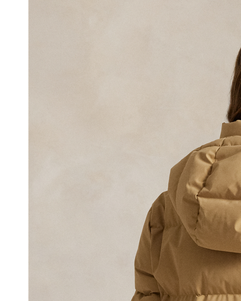 Combining a water-repellent shell and insulating, 750-fill-power down, this quilted jacket features a removable drawstring hood, two-way zip placket and protective snapped storm placket. Our signature embroidered Pony adorns the chest.