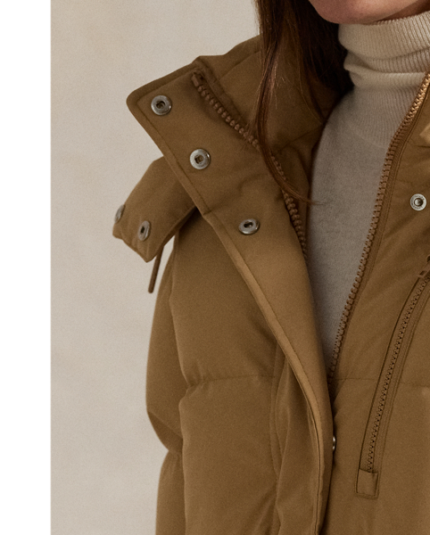 Combining a water-repellent shell and insulating, 750-fill-power down, this quilted jacket features a removable drawstring hood, two-way zip placket and protective snapped storm placket. Our signature embroidered Pony adorns the chest.