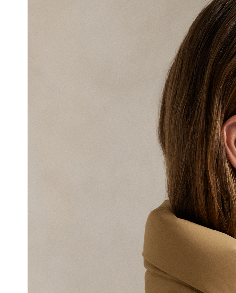 Combining a water-repellent shell and insulating, 750-fill-power down, this quilted jacket features a removable drawstring hood, two-way zip placket and protective snapped storm placket. Our signature embroidered Pony adorns the chest.