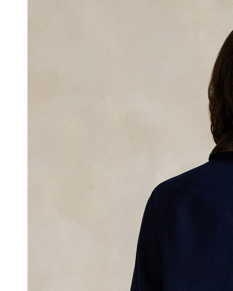 Woven with cotton for a medium weight, this workwear-inspired utility jacket has a relaxed shape outfitted with a corduroy collar, patch pockets and signature engraved metal snaps.