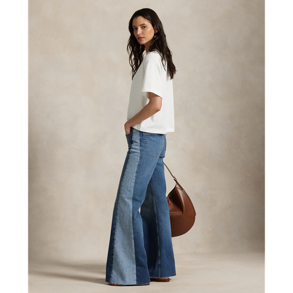 Designed for a flared silhouette, these jeans are made with soft cotton-blend denim to achieve a lightweight and open-ended vintage-inspired character. The panelled construction combines two shades of indigo for a colour-blocked effect, with grinding at the seams and uneven hand-sanding throughout.