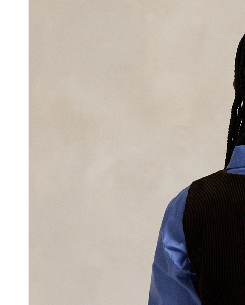 Crafted with soft, wide-wale corduroy and lined with smooth cupro twill, this menswear-inspired waistcoat is constructed with a buttoned placket, notched front hem and an adjustable buckled detail at the back waist.