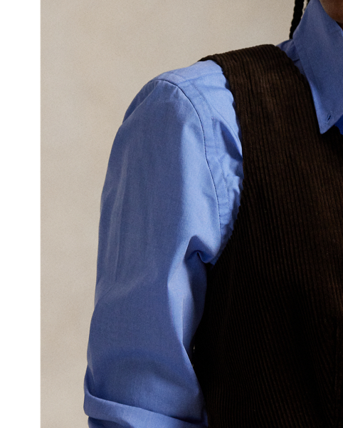 Crafted with soft, wide-wale corduroy and lined with smooth cupro twill, this menswear-inspired waistcoat is constructed with a buttoned placket, notched front hem and an adjustable buckled detail at the back waist.