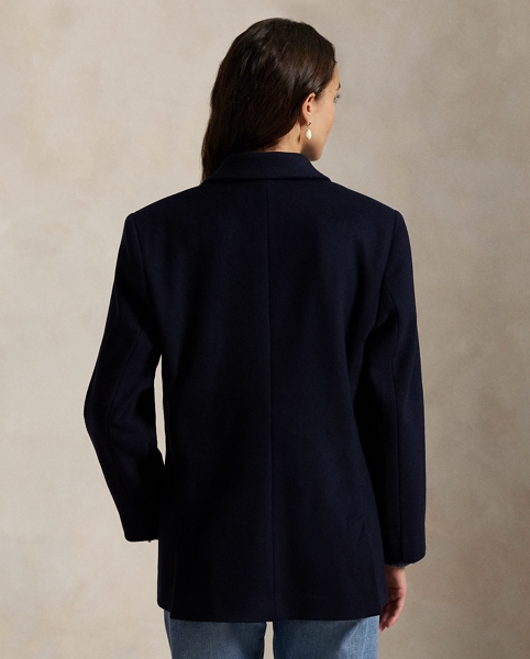 Finely crafted with Italian wool melton, this structured double-breasted jacket is designed with shoulder pads and a partial cupro lining. It's adorned with signature engraved buttons for a heritage-inspired finish.