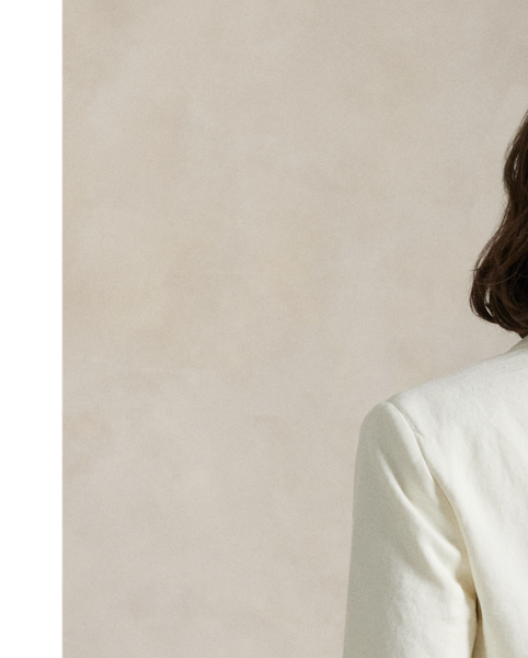 Designed for a light weight, this double-breasted blazer combines hemp fabric with a partially lined construction. The tailored silhouette features menswear-inspired details, including peak lapels and besom pockets.