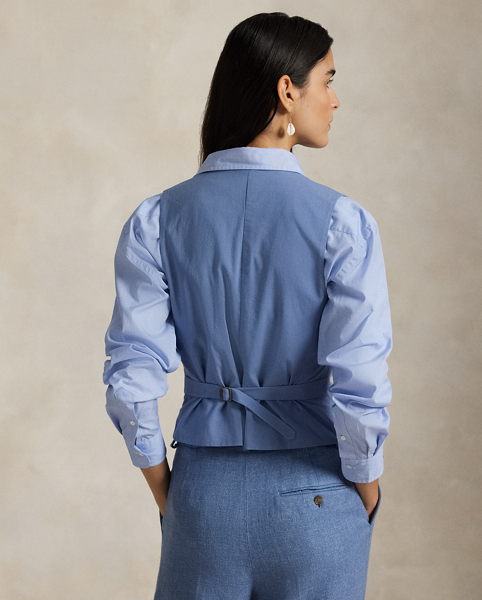 Woven with a blend of Italian linen and cotton yarns, this menswear-inspired twill waistcoat is constructed with a buttoned placket, notched front hem and an adjustable buckled detail at the back waist.