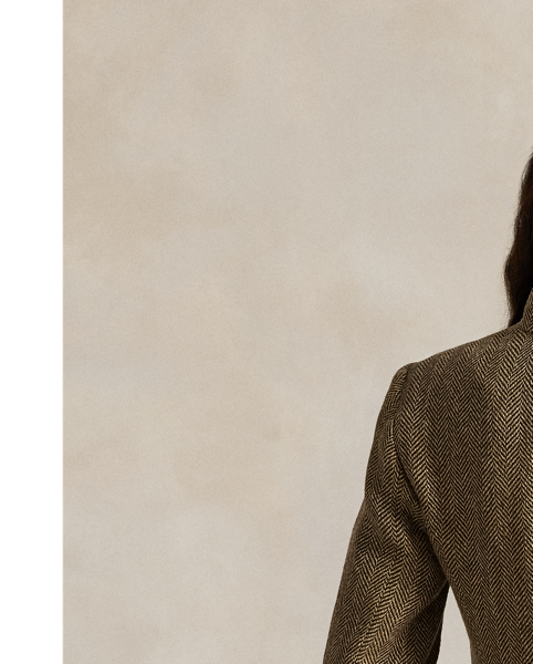 Realised in classic herringbone fabric with a blend of linen, silk and wool, this jacket is defined by utility-inspired pocketing and a buttoned throat latch at its mockneck collar.