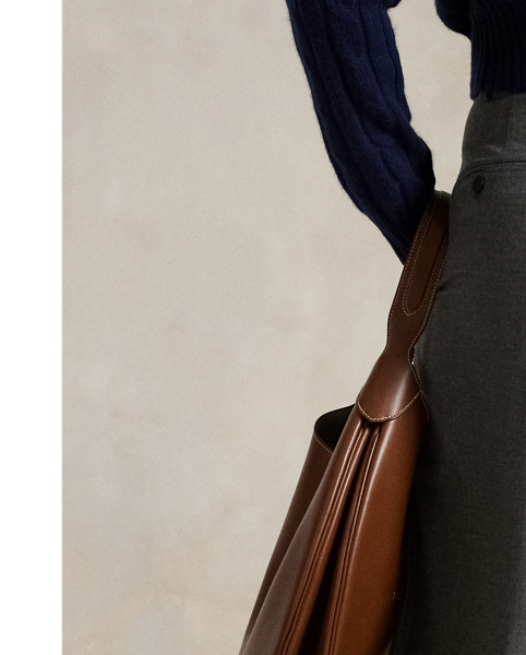 Designed for a tailored drape, these Italian stretch-wool flannel trousers unite a high-rise waist and wide-leg silhouette. Pressed creases and folded cuffs complete the look.