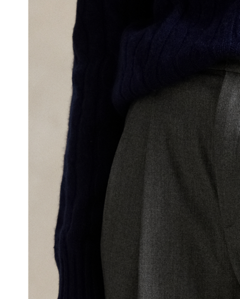Designed for a tailored drape, these Italian stretch-wool flannel trousers unite a high-rise waist and wide-leg silhouette. Pressed creases and folded cuffs complete the look.