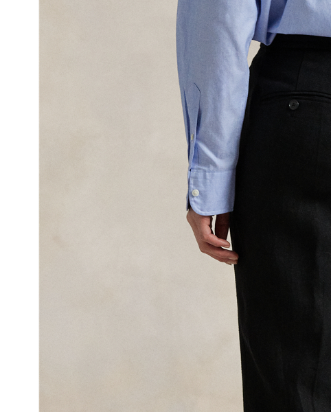 Cut for a relaxed, straight silhouette, these linen trousers showcase menswear-inspired details, including tailored creases, buttoned besom pocketing and cuffed hems.
