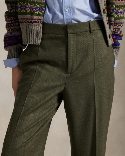 These wool twill trousers are cut for a relaxed, straight fit and have menswear-inspired details like an interior curtain waistband and crisp creases at the legs.