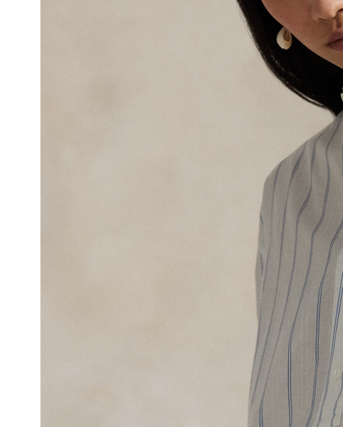 Cut from lightweight cotton dobby, this top is designed for a loose, oversize silhouette with yarn-dyed vertical stripes and a buttoned half-placket.