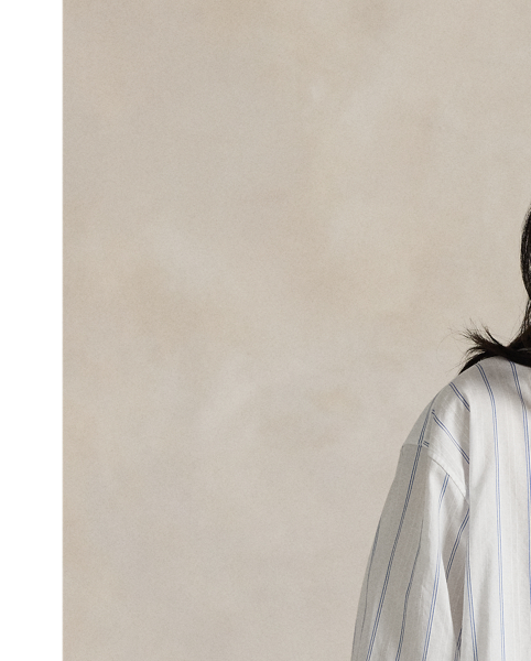 Cut from lightweight cotton dobby, this top is designed for a loose, oversize silhouette with yarn-dyed vertical stripes and a buttoned half-placket.