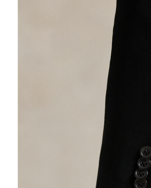 Woven with a cotton blend, this double-knit blazer is cut for a soft yet structured silhouette and finished with notch lapels.