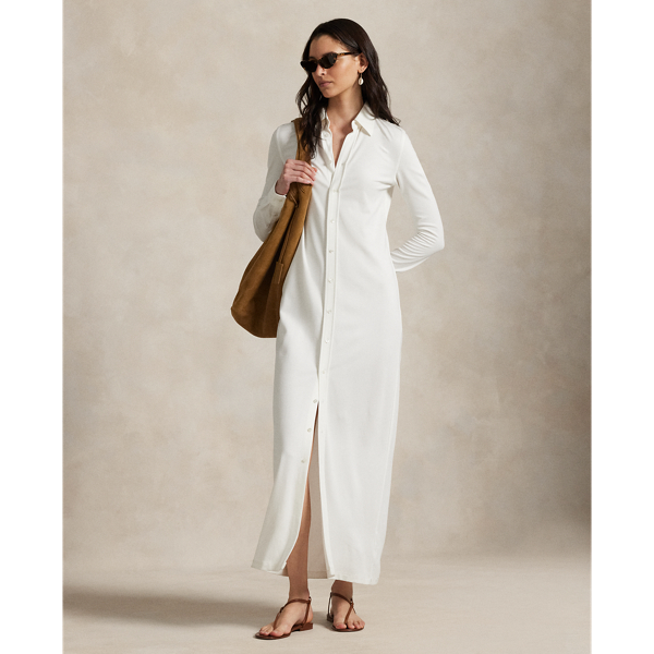Crafted from medium-weight ponte fabric with a touch of stretch, this shirtdress is cut for an elongated maxi silhouette with a spread collar and full buttoned placket.