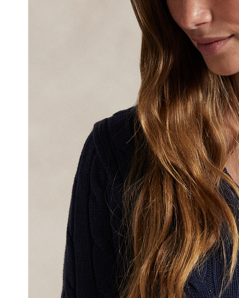 Crafted with combed cotton for a soft hand, this classic V-neck jumper is defined by a cable-knit construction and a slim-fitting silhouette. Our embroidered Pony on the chest lends a signature finish.