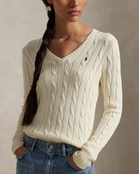 Crafted with combed cotton for a soft hand, this classic V-neck jumper is defined by a cable-knit construction and a slim-fitting silhouette. Our embroidered Pony on the chest lends a signature finish.