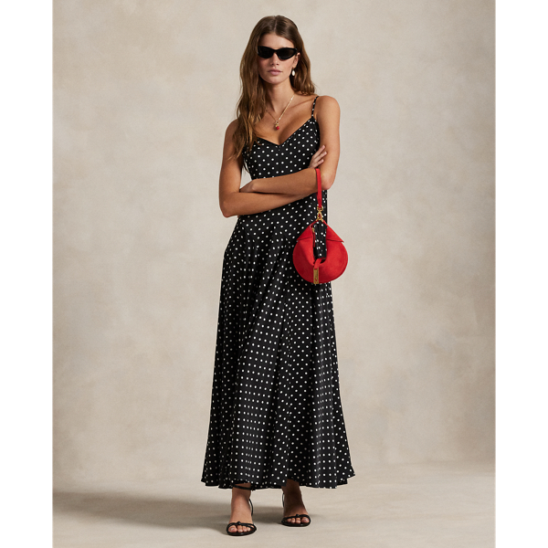 Printed with a polka dot motif, this satin dress combines a fitted seamed bodice with a full skirt for sweeping movement. Adjustable spaghetti straps allow for a personalised fit.