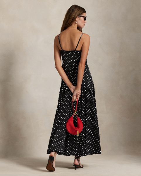 Printed with a polka dot motif, this satin dress combines a fitted seamed bodice with a full skirt for sweeping movement. Adjustable spaghetti straps allow for a personalised fit.