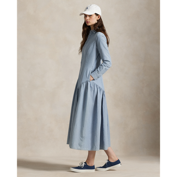 Princess seams on the bodice and a shirred triangle yoke above the skirt bring a fresh perspective to the classic shirtdress. This version is woven with cotton-and-linen chambray fabric and dyed with true indigo.