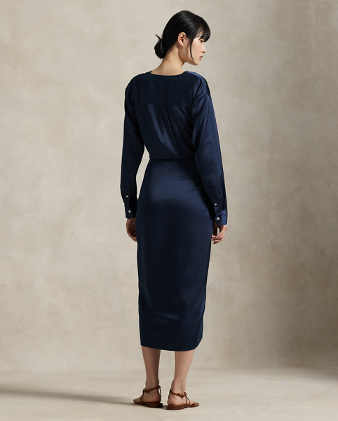 Rendered in soft-falling, lightweight satin, this elegant piece merges classic shirtdress details, like a buttoned placket and pleated back yoke, with a V-neckline and tie-front wrap detail at the waist.