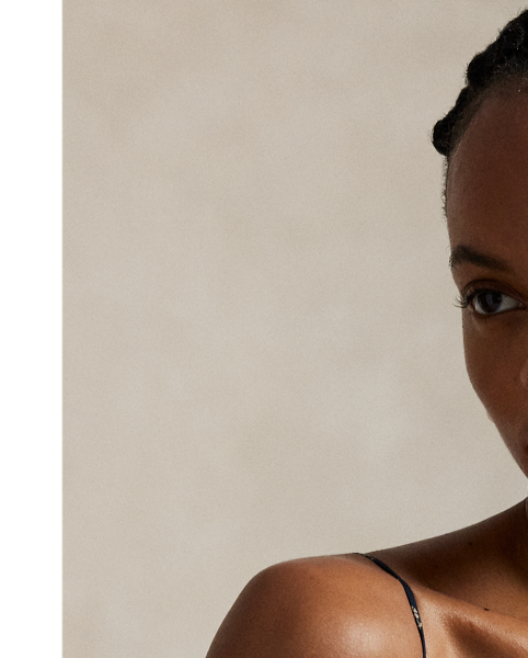 With a sleeveless silhouette reminiscent of a camisole, this flowing A-line dress has a panelled construction and an all-over floral motif.