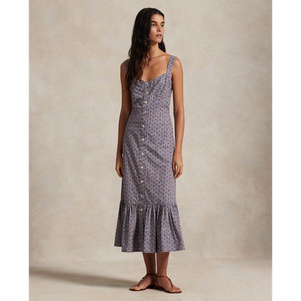 This quintessential warm-weather dress is crafted with floral-print cotton and features a front placket with genuine mother-of-pearl buttons. The fitted bodice and tiered hem create a classic A-line silhouette.