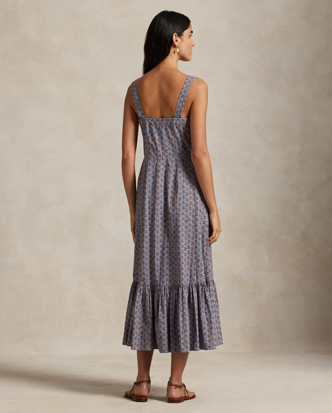 This quintessential warm-weather dress is crafted with floral-print cotton and features a front placket with genuine mother-of-pearl buttons. The fitted bodice and tiered hem create a classic A-line silhouette.