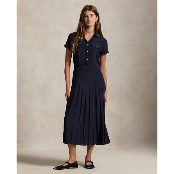 Crafted with smooth silk, this short-sleeve shirtdress combines a classic spread collar and buttoned placket with a pleated A-line skirt.