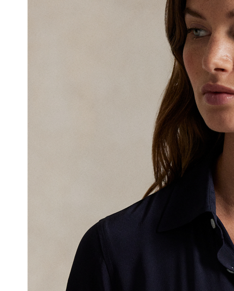 Crafted with smooth silk, this short-sleeve shirtdress combines a classic spread collar and buttoned placket with a pleated A-line skirt.