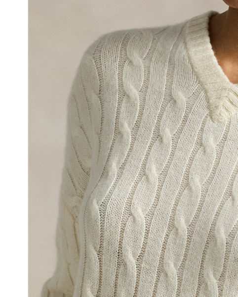 This V-neck jumper is cable-knit with soft Italian cashmere for a relaxed silhouette that features dropped shoulders and rib-knit edges.