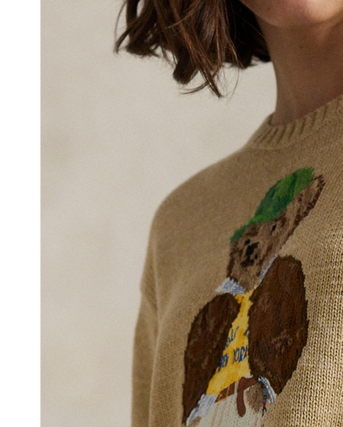 This cotton crewneck jumper showcases an intarsia-knit and embroidered rendering of the Polo Bear donning a  Ralph Lauren Lauren look, complete with a signature Pony ball cap.