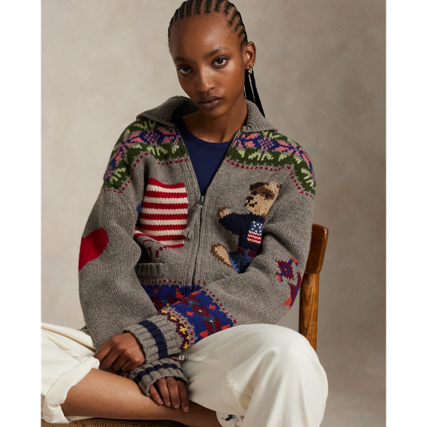 This wool cardigan is decorated with intarsia-knit motifs throughout, including Fair Isle-inspired patterns, the Polo Bear and signature  Ralph Lauren Lauren logos. The relaxed silhouette features an enveloping shawl collar and full-zip placket.
