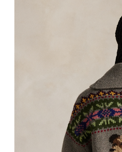 This wool cardigan is decorated with intarsia-knit motifs throughout, including Fair Isle-inspired patterns, the Polo Bear and signature  Ralph Lauren Lauren logos. The relaxed silhouette features an enveloping shawl collar and full-zip placket.