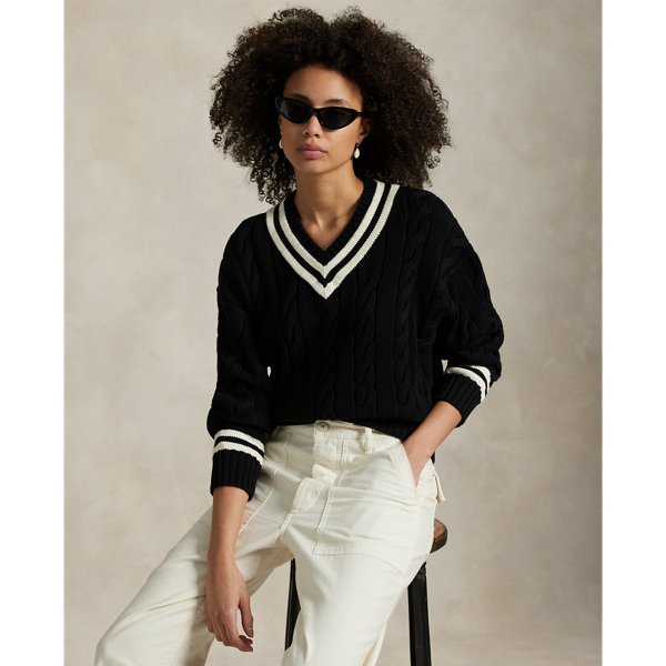Inspired by the classic cricket jumper – an enduring Polo staple – this season's version is Aran-knit with cotton for soft texture and features contrast stripes at the neckline, cuffs and hem.