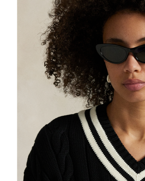 Inspired by the classic cricket jumper – an enduring Polo staple – this season's version is Aran-knit with cotton for soft texture and features contrast stripes at the neckline, cuffs and hem.