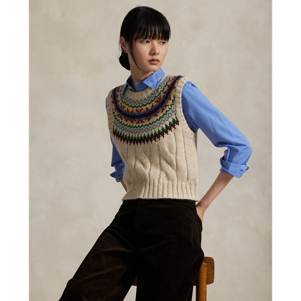 Rendered in heavyweight cotton-and-wool blend yarns, this sleeveless jumper combines a wide cable-knit construction and rounded yoke featuring a colourful Fair Isle-inspired motif.