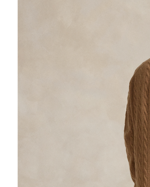 Designed for a slightly relaxed fit, this V-neck jumper dress is cable-knit with Italian wool and cashmere yarns to achieve its classic textural motif.