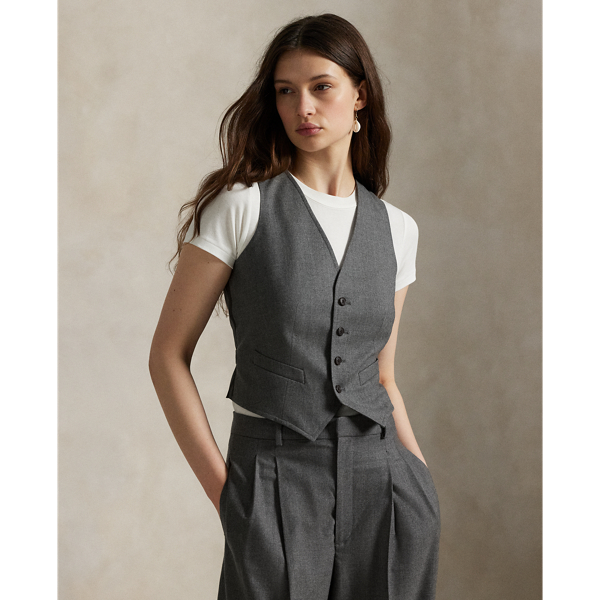 Crafted with an Italian stretch-wool fabric front panel, this menswear-inspired waistcoat is constructed with a buttoned placket, a notched hem and an adjustable buckled detail at the back waist.