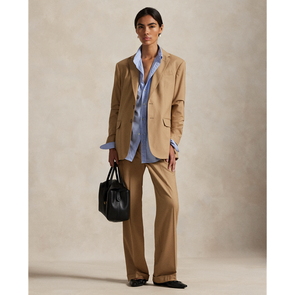 Crafted from a wool blend, these wide-leg trousers feature menswear-inspired details, including a pleated front waist and crisp creases along each leg.