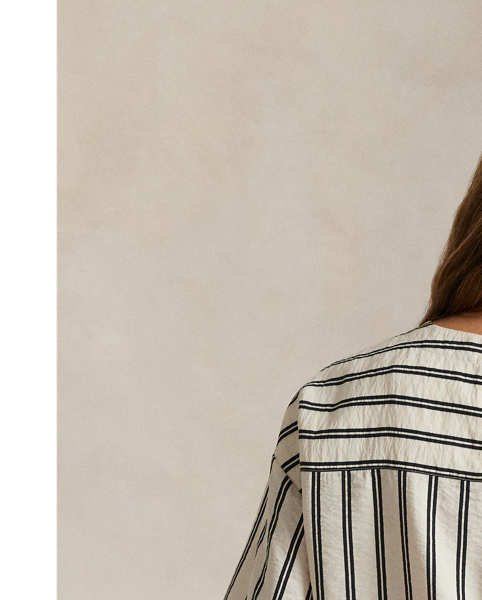 Crafted from a silk blend, this striped short-sleeve top features a clean-lined construction with a panelled back yoke and dropped shoulders.